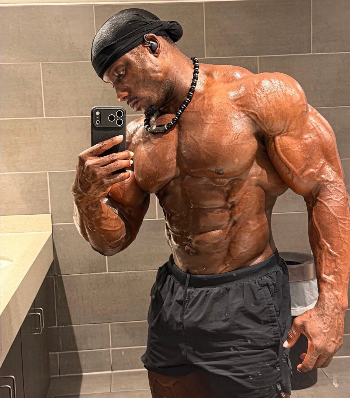 Robert Timms checking his conditioning in the mirror during the offseason